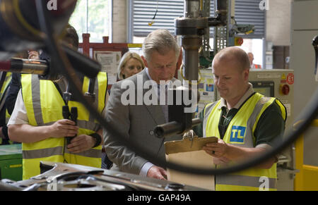 The Prince of Wales, talks with workers during a visit to celebrate the 60th anniversary of Land Rover at the company's factory, in Lode Lane, Solihull. Stock Photo