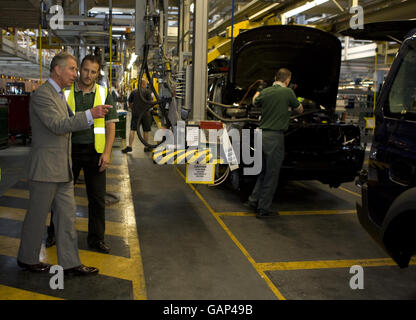 The Prince of Wales, talks with workers during a visit to celebrate the 60th anniversary of Land Rover at the company's factory, in Lode Lane, Solihull. Stock Photo