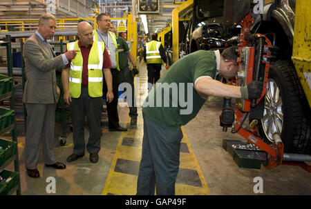 The Prince of Wales, talks with workers during a visit to celebrate the 60th anniversary of Land Rover at the company's factory, in Lode Lane, Solihull. Stock Photo