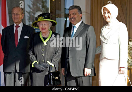 Britain's Queen Elizabeth II attends a welcoming ceremony at the Presidential Palace with the Duke of Edinburgh, President Abdullah Gul and Harunnisa Gul on the first day of their State Visit to Turkey. Stock Photo