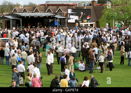 Horse Racing - Bet365 Gold Cup Meeting - Sandown Park. Racegoers gather as The Saw Doctors perform during a concert at the end of the Gold Cup Meeting at Sandown Park. Stock Photo