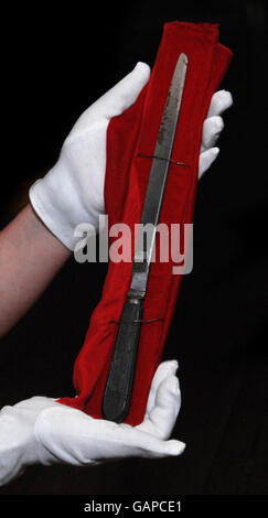 A person holds a knife allegedly used by Jack the Ripper during his East End London murders, which forms part of the Jack the Ripper exhibition in the Museum in Docklands opening tomorrow. Stock Photo