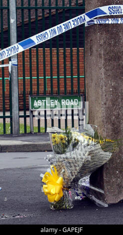 Flowers are left at the scene on Astley Road in Huyton, Liverpool, where a six-year-old girl was killed in a hit-and-run crash when she was knocked down by a van last night. Stock Photo