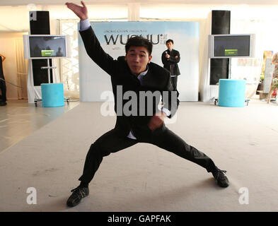 Actor Wang Wenjie during a photocall to promote new film Wushu on the La Diva Beach in Cannes, France. Stock Photo