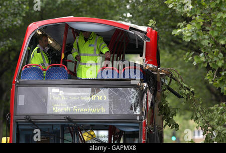 Police officers at the scene of an accident involving a bus at the junction of Tanner Street and Tower Bridge Road, London. Stock Photo