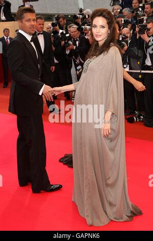 Pregnant Angelina Jolie and Brad Pitt arrive for the screening of 'Changeling' during the 61st Cannes Film Festival in Cannes, France. Stock Photo