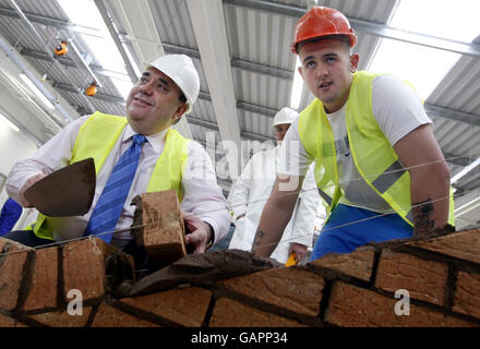 First Minister Alex Salmond (left) talks with Sean Monaghan, 19, during a visit to John Wheatley College in Glasgow. Stock Photo