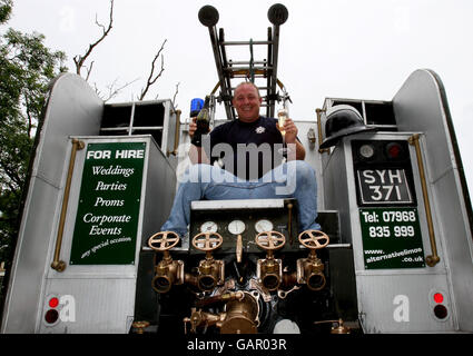 Lee Russell, from Holywell, St Ives, Cambridgeshire, sits on the back of his Green Goddess fire engine after transforming it into a luxury limousine.