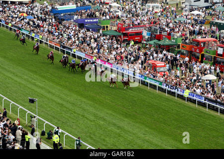 New Approach and jockey Kevin Manning (green hat) win The Vodafone Derby at Epsom Downs Racecourse, Surrey.