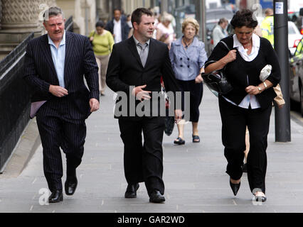 Father Jim Scott (left) brother David Scott (centre) and mother Lorraine Scott arrive at Edinburgh Sheriff Court for the fatal accident inquiry into the death of Danielle Scott who was given the heroin substitute methadone. Stock Photo