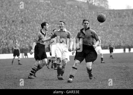 Wolverhampton Wanderers' Dicky Dorsett (r) and Bill Morris (l) pull up as Charlton Athletic's Sailor Brown (c) is flagged offside Stock Photo