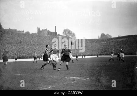 Wolverhampton Wanderers' Dicky Dorsett (r) and Bill Morris (l) pull up as Charlton Athletic's Sailor Brown (c) is flagged offside Stock Photo