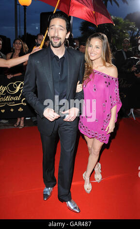 Adrien Brody and Elsa Pataky arrive at the Palm Beach Casino for the Partouche Charity Poker Festival in Cannes, France during the 61st Cannes International Film Festival. Stock Photo