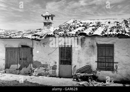 Black and white shot of a derelict house on Crete, Greece Stock Photo