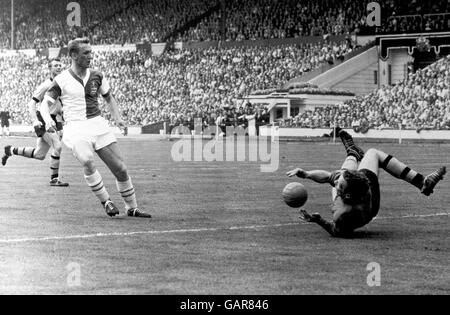 Wolverhampton Wanderers goalkeeper Malcolm Finlayson (r) saves from Blackburn Rovers' Peter Dobing (l) Stock Photo