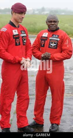 The Archbishop of York, Dr John Sentamu (right) with Major Nick Vischer of the Red Devils parachute display team at Langar Airfield in Nottinghamshire before his planned charity parachute jump was cancelled. Stock Photo