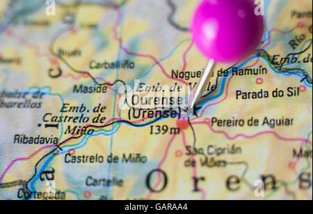 Pushpin marking on Orense, Spain. Selective focus on city