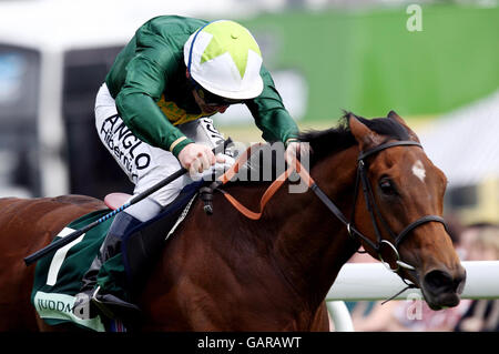 Look Here riden by Seb Sanders comes home to win the Juddmonte Oaks at Epsom Downs Racecourse, Surrey. Stock Photo