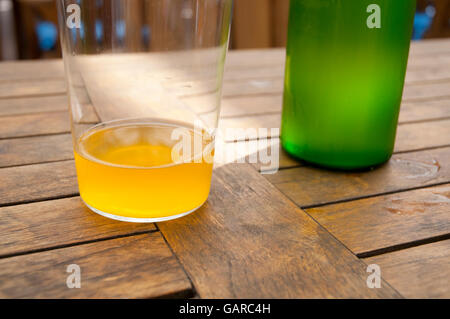 Glass and bottle of cider. Asturias, Spain. Stock Photo