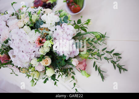 Serving wedding table flowers. Design Bureau for newlyweds Stock Photo
