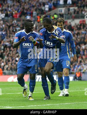 Soccer - FA Cup - Final - Portsmouth v Cardiff City - Wembley Stadium. Portsmouth's Nwankwo Kanu celebrates scoring his sides first goal of the game with teammate Sulley Muntari (left) Stock Photo