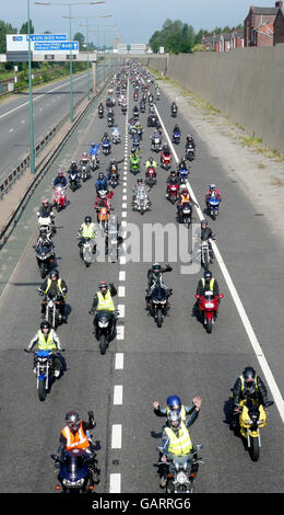 Bikers protest against rising fuel prices on the M62, Salford, in a slow-moving convoy causing rush-hour disruption to the area.