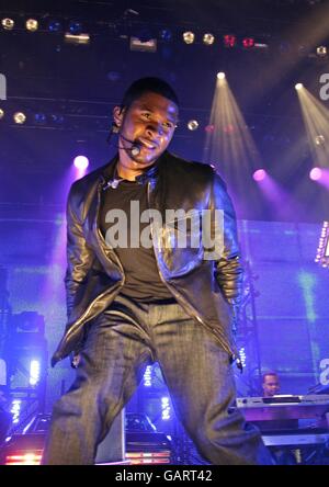 Usher in concert - London. Usher performs an exclusive Sony Ericsson gig at the Indig02 at the O2 Arena in Greenwich, London. Stock Photo