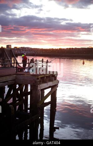 Fishing at sunset, River Tyne, Harton Quays, South Shields Stock Photo