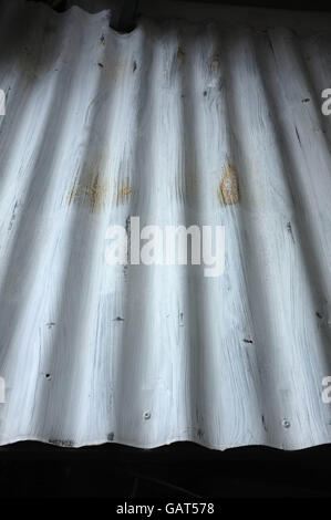 Silver corrugated metal with bolts Stock Photo