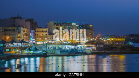 Malta, Bugibba: Panoramic night view of the popular tourist destination in the north-western part of Malta. Stock Photo