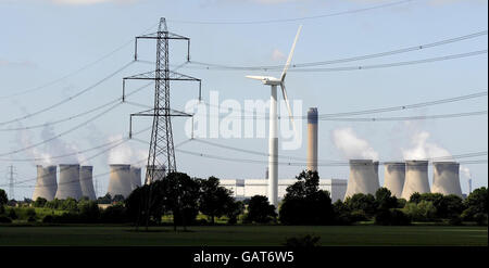 A general view of a wind turbine in East Yorkshire against a backdrop of Drax power station. Stock Photo