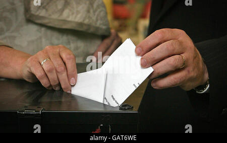 Taoiseach Brian Cowen (right hand) and his wife Mary, cast their votes in the Lisbon treaty referendum at Mucklagh National school in Co Offaly. Stock Photo