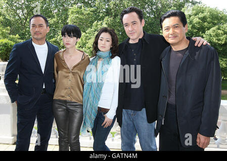 (L-R) Ken Watanabe, Rinko Kikuchi, Gong Li, John Cusack and Chow Yun-Fat at a photocall for new film Shanghai at the Mandarin Oriental Hotel in London. Stock Photo