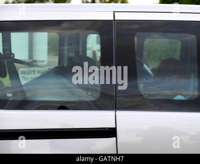 Abu Qatada freed. Firebrand preacher Abu Qatada (rear) being driven out of Long Lartin prison in Worcestershire. Stock Photo