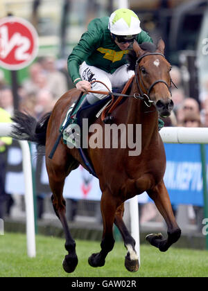 Horse Racing - The 2008 Derby Festival - Ladies Day - Epsom Downs Racecourse. Look Here riden by Seb Sanders comes home to win the Juddmonte Oaks at Epsom Downs Racecourse, Surrey Stock Photo