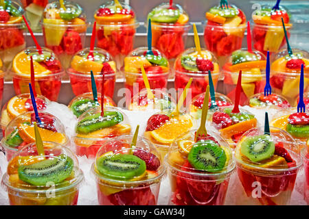 Fresh Fruit cocktail salad in plastic cups on a market stall Stock Photo