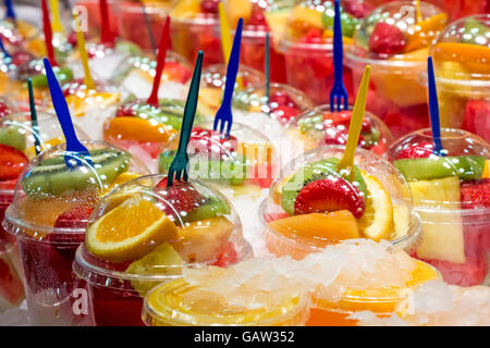 Fresh Fruit cocktail salad in plastic cups on a market stall Stock Photo