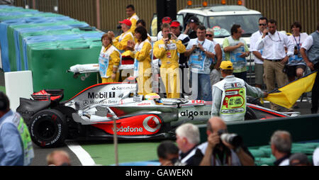 Formula One Motor Racing - French Grand Prix - Race - Magny Cours. Lewis Hamilton is directed to the back of the garages after finishing 10th during the Grand Prix at Magny-Cours, Nevers, France. Stock Photo
