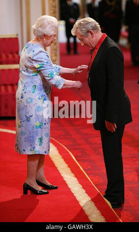 Actor Sir Ian McKellen receives Companion of Honour medal for services to Drama and Equality, from Queen Elizabeth II during an Investiture ceremony at Buckingham Palace, London. Stock Photo