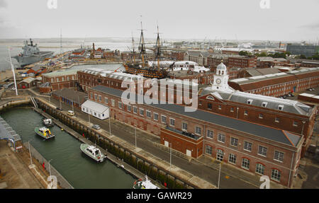 General view of Portsmouth Harbour and Royal Navy Dockyard seen from the top of Semaphore Tower in the naval dockyard in Portsmouth. The Queen's Harbour Master is based at the tower and controls all vessel movements, large and small into the narrow entrance. PRESS ASSOCIATION Photo. Picture date: Wednesday June 25, 2008. The picture shows a view looking north to Portsdown Hill in the distance, the naval flagship HMS Ark Royal (left), Nelson's flagship HMS Victory (centre), and the historic buildings of the oldest operating naval dockyard in the world. Photo credit should read: Chris Ison/PA Stock Photo