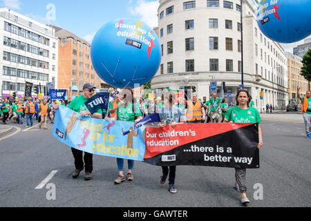 Bristol, UK. 5th July, 2016. Striking teachers and their supporters are pictured as they make their way through the city centre during a march and rally in the city centre.The demonstration was part of a national day of action called by the NUT to support a teachers strike on July 5th. Credit:  lynchpics/Alamy Live News Stock Photo