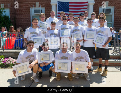 Wantagh, New York, USA. July 4, 2016. High school Wantagh Warriors baseball team members pose for group photo with Certificates issued by Nassau County Supervisor, at the 60th Annual Miss Wantagh Pageant, an Independence Day tradition on Long Island. Legislator STEVE RHOADS, top row at left, (Rep - District 19) is the Representative for District 19 in Nassau County Legislature. The Wantagh Warriors baseball team won another county championship, its third Long Island Championship and its second New York State Class A championship. Stock Photo