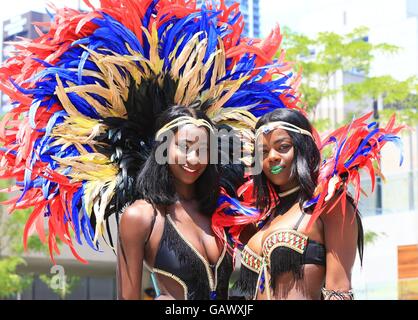 Toronto, Canada. 5th July, 2016. Dressed up revellers perform during the official launch ceremony of the 2016 Toronto Caribbean Carnival at Nathan Philips Square in Toronto, Canada, July 5, 2016. As the largest cultural festival of its kind in North America, the annual exciting three-week cultural explosion of Caribbean music, cuisine and revelry as well as visual and performing arts kicked off on Tuesday. Credit:  Zou Zheng/Xinhua/Alamy Live News Stock Photo