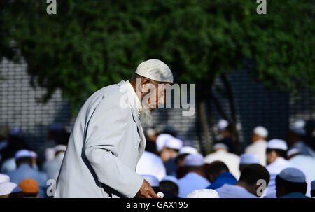 Xining, China's Qinghai Province. 6th July, 2016. An elder of Hui ethnic group participates in prayers at the Dongguan Mosque in Xining, capital of northwest China's Qinghai Province, July 6, 2016. Muslims on Wednesday across China celebrated the Eid al-Fitr, which marks the end of the Muslim holy month of Ramadan. Credit:  Zhang Hongxiang/Xinhua/Alamy Live News Stock Photo