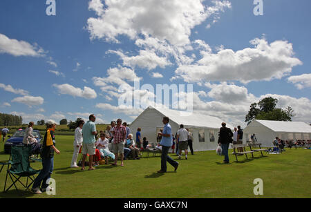 Cricket - Charity Event - Belvoir Cricket Club. Spectators watch the charity match between the Duke of Rutland XI and the Sir Richard Hadlee XI, at Belvoir Cricket Club. Stock Photo