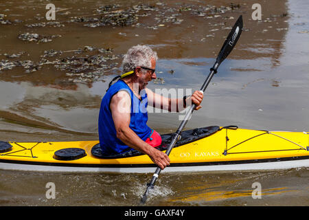 An Elderly Man Kayaking On The River Ouse, Lewes, Sussex, UK Stock Photo