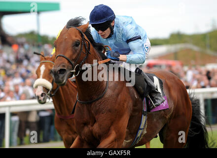 Redford ridden by Jamie Spencer (right) beats The Osteopath ridden by Royston French to win The toteswinger Handicap Stakes at Newcastle Racecourse. Stock Photo