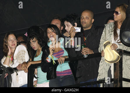 Beyonce Knowles (Far Right), Amy Winehouse (2nd Left) and Jack White (3rd Right) amongst other unidentified festival goers watching Jay-Z perform on the Pyramid Stage during day two of the Glastonbury Festival, Somerset. Stock Photo