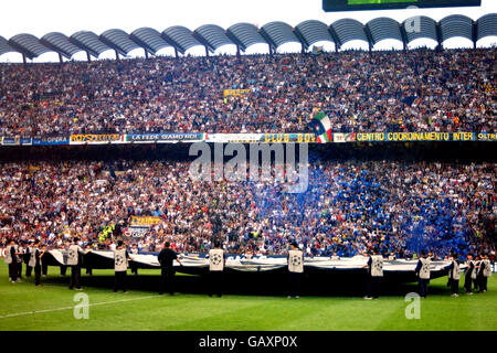 Soccer - UEFA Champions League - Semi Final - Second Leg - Inter Milan v AC Milan. Ballboys surround the giant UEFA Champions League starball logo in the centre circle Stock Photo