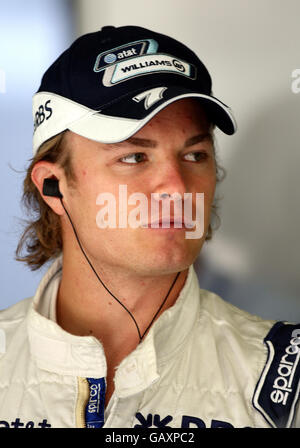 Williams driver Nico Rosberg waits in his garage during first practice of at Magny-Cours, Nevers, France. Stock Photo